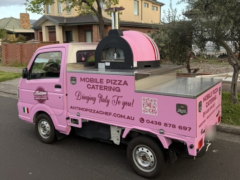 Our pink Antimo Pizza Chef truck in Adelaide with its wood-fired oven