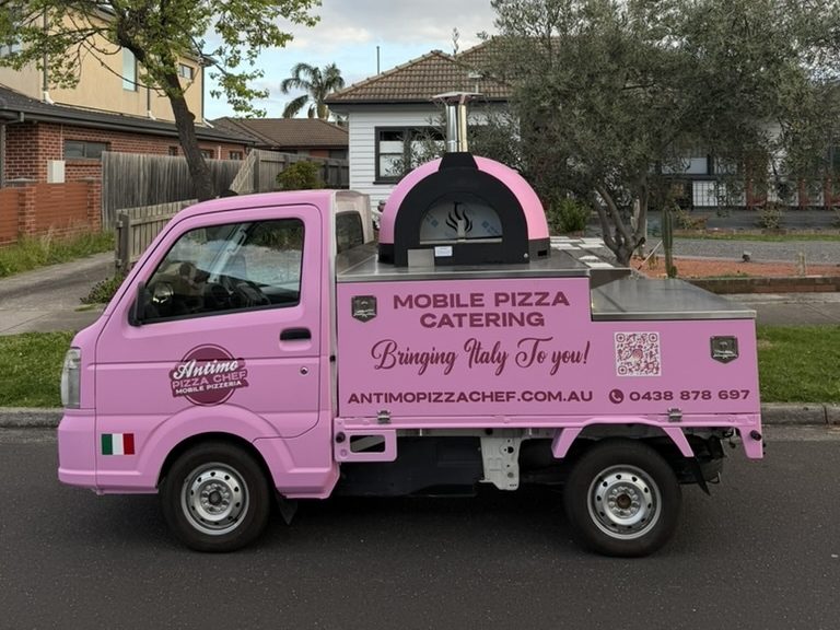 Our new pink pizza truck for Adelaide events, with its pink and black wood-fired oven