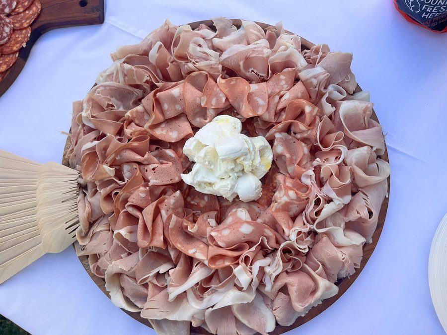 Top-down antipasto platter with fresh burrata in the centre