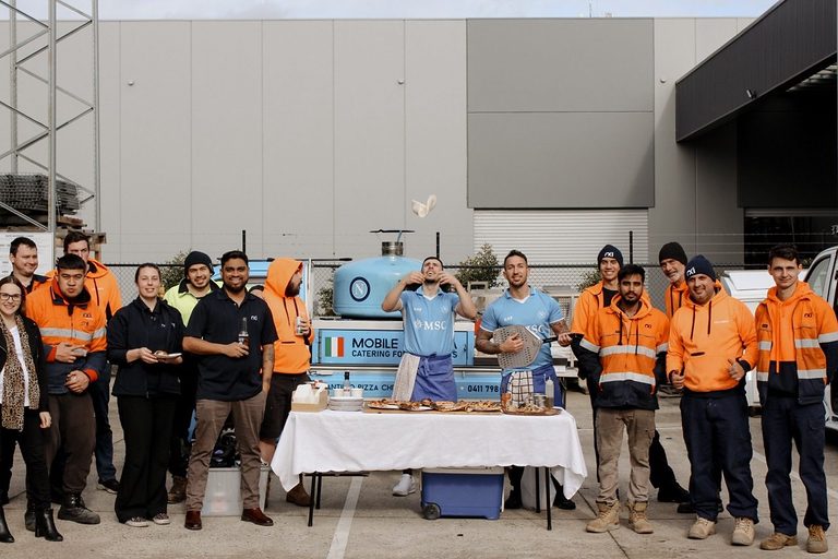 Workplace team lined up with the Antimo Pizza Chef truck