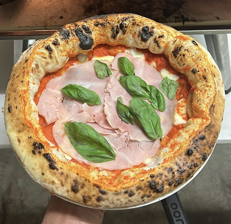 Pizza with mortadella, burrata and fresh basil