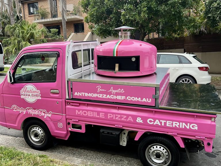 Lady Oscar 1.0, the pink Antimo Pizza Chef mobile pizzeria truck with its pink wood-fired oven
