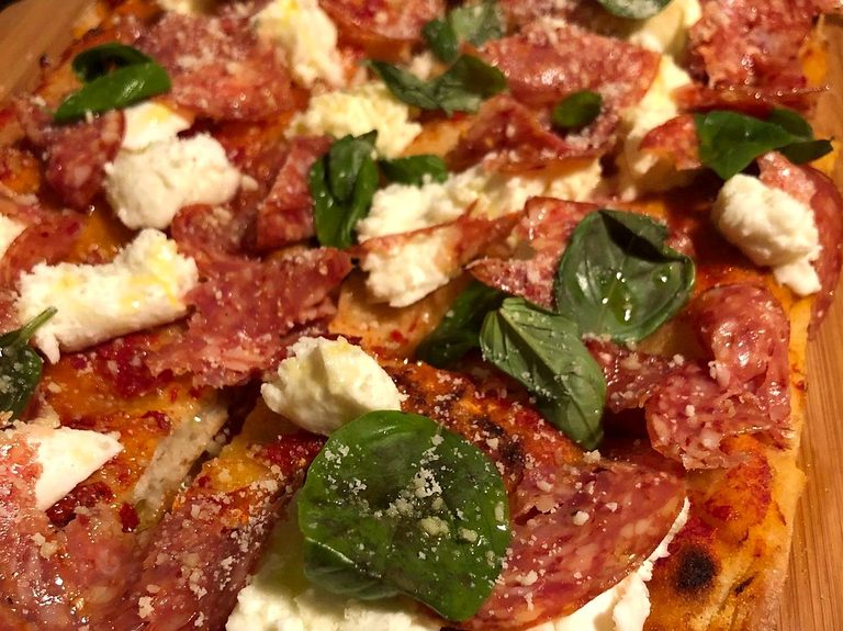 Pinsa Romana with salami, fresh cheese and basil, pizza catering Melbourne